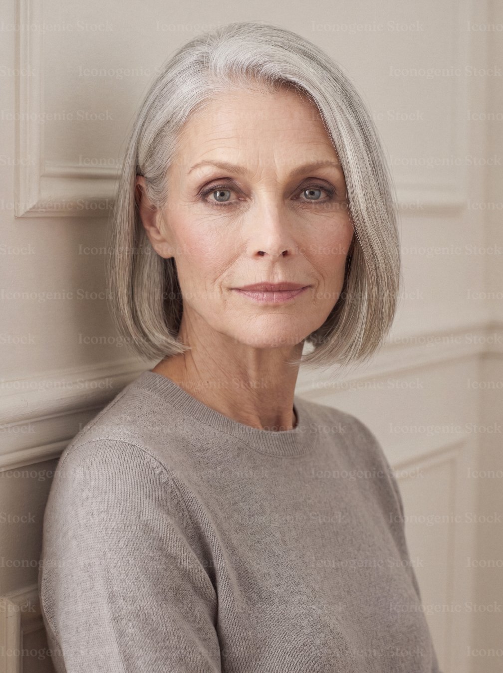 Elegant senior woman with gray bob hairstyle posing indoors, calm confident expression