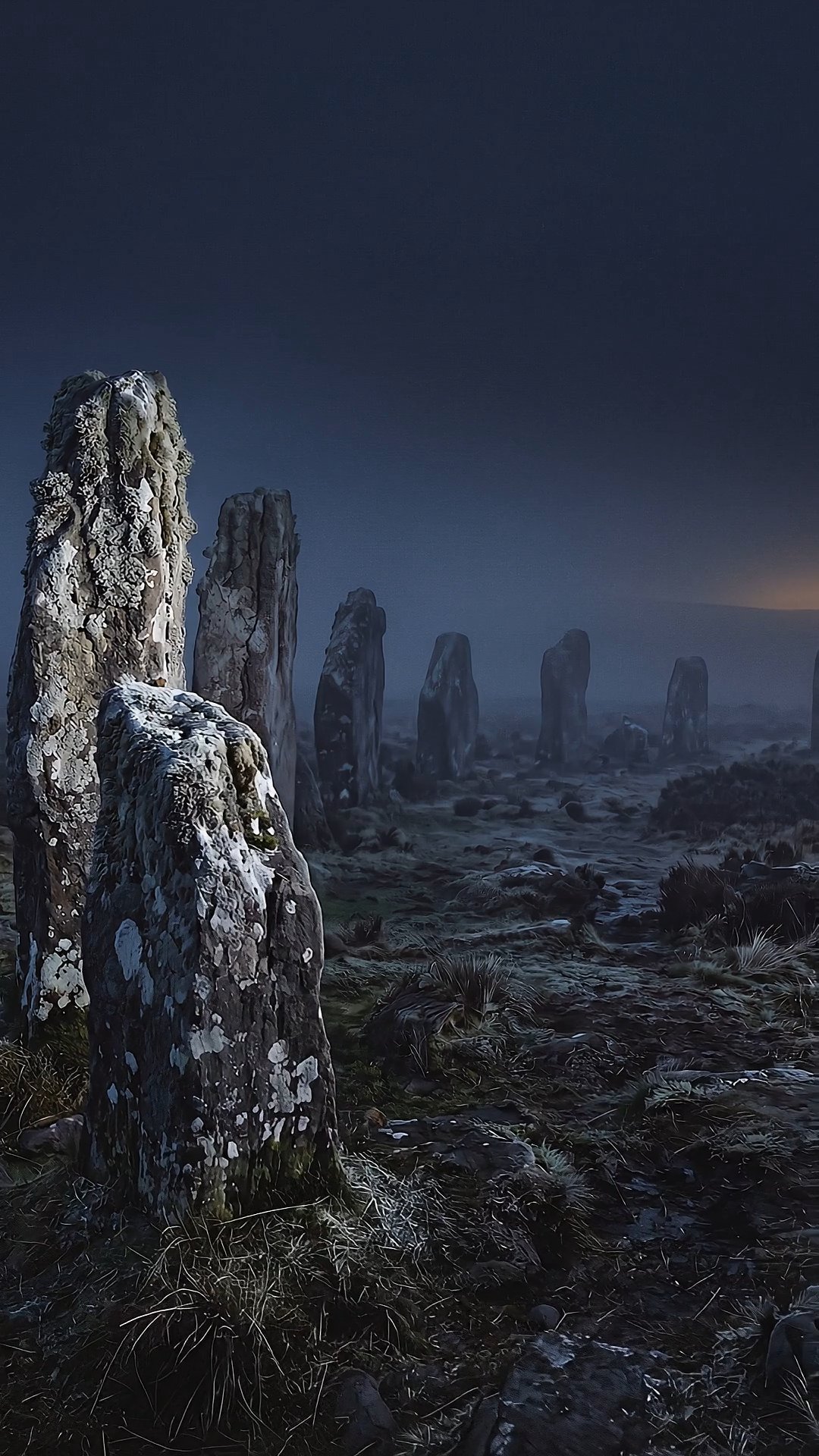 Ancient standing stones shrouded in mist at twilight, moody Scottish landscape